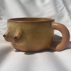 Banilla colored BoobyPot mug with cinnamon dot nipples.